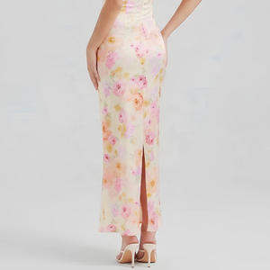 Floral dress with a high slit on a plain background