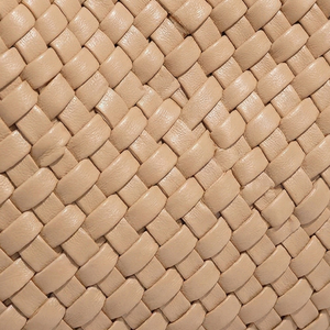 Close-up of beige woven leather texture
