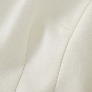 Close-up of a textured white fabric surface