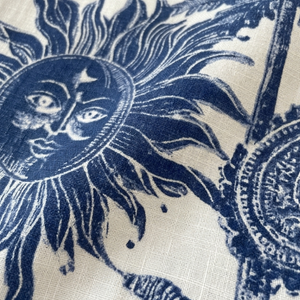 Close-up of a blue sun design on fabric