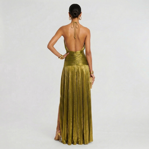 Woman wearing a gold evening gown with a white background