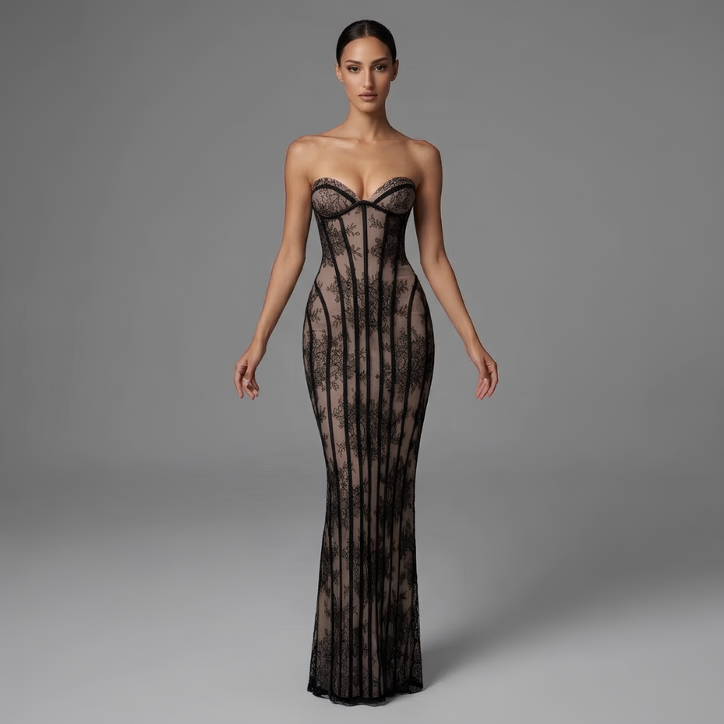 Woman wearing a black lace strapless gown on a gray background