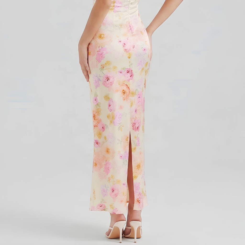 Floral dress with a high slit on a plain background