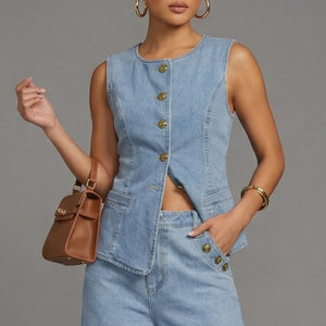 Woman wearing a denim outfit with a brown handbag on a gray background