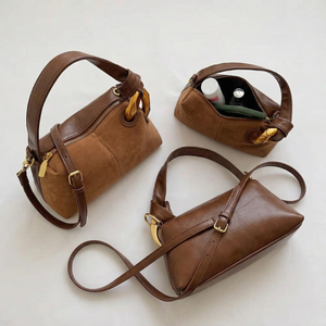 Three brown leather handbags with gold accents on a light background