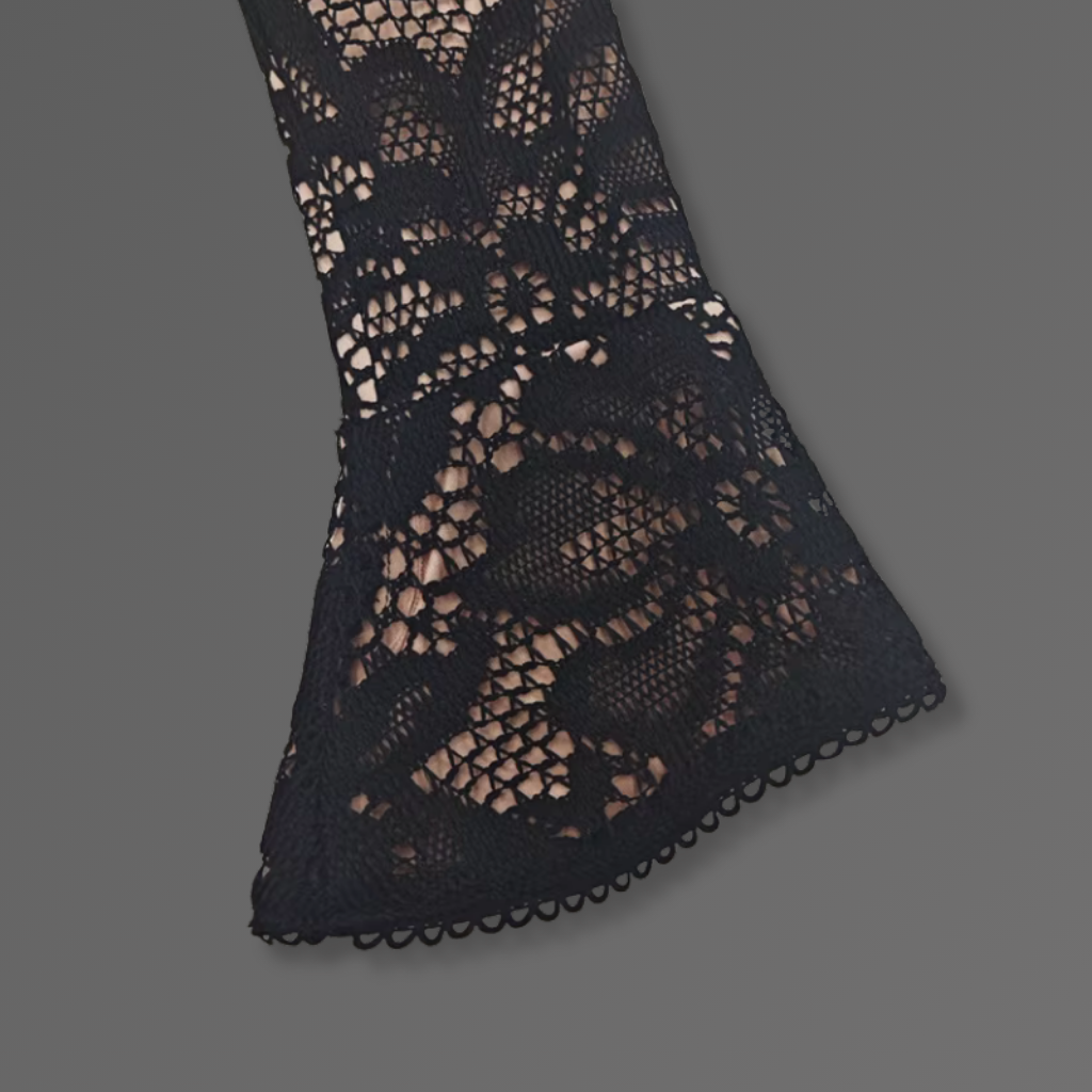 Black lace fabric on a gray background