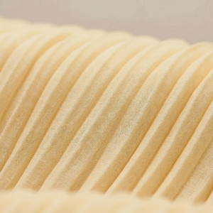 Close-up of beige ribbed fabric texture