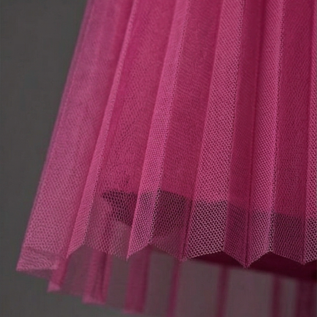 Close-up of a pink textured fabric against a gray background