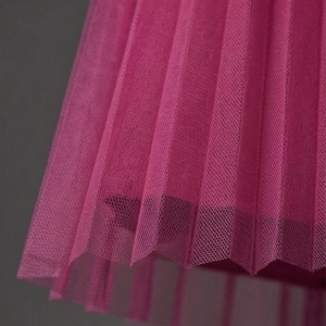 Close-up of a pink textured fabric against a gray background
