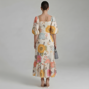 Woman wearing a floral dress with a plain background