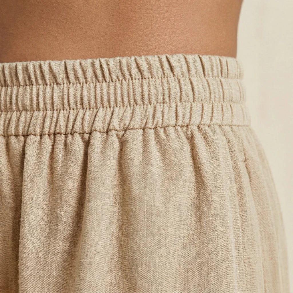 Close-up of beige pants with an elastic waistband