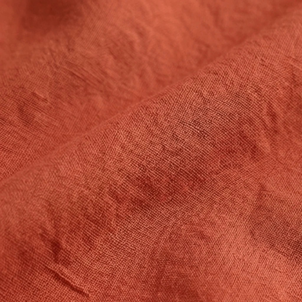 Close-up of textured rust-colored fabric