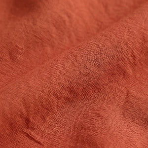 Close-up of textured rust-colored fabric