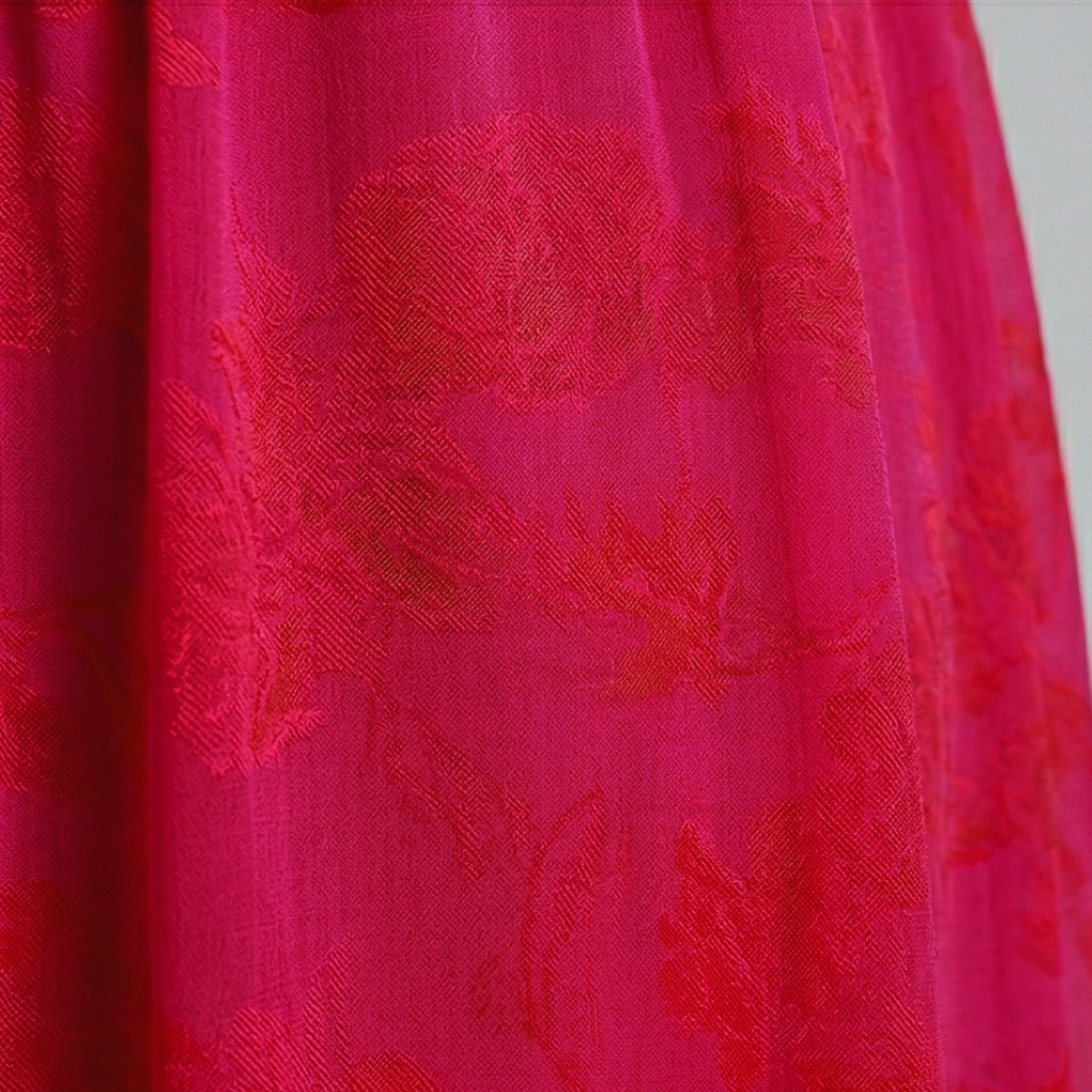 Close-up of pink fabric with floral pattern