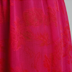 Close-up of pink fabric with floral pattern