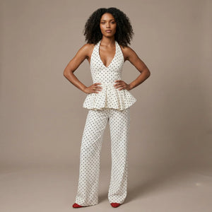 Woman wearing a polka dot outfit on a beige background