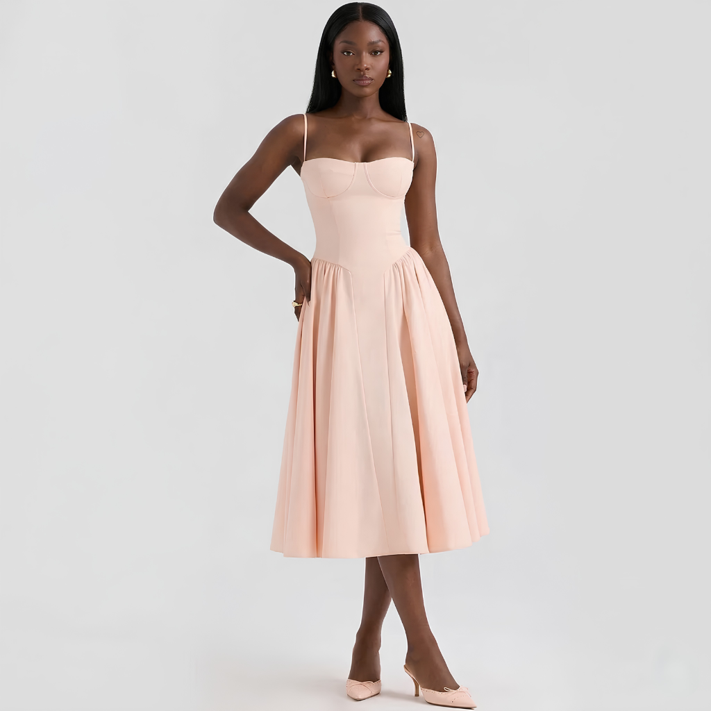 Woman wearing a light pink strapless dress on a white background